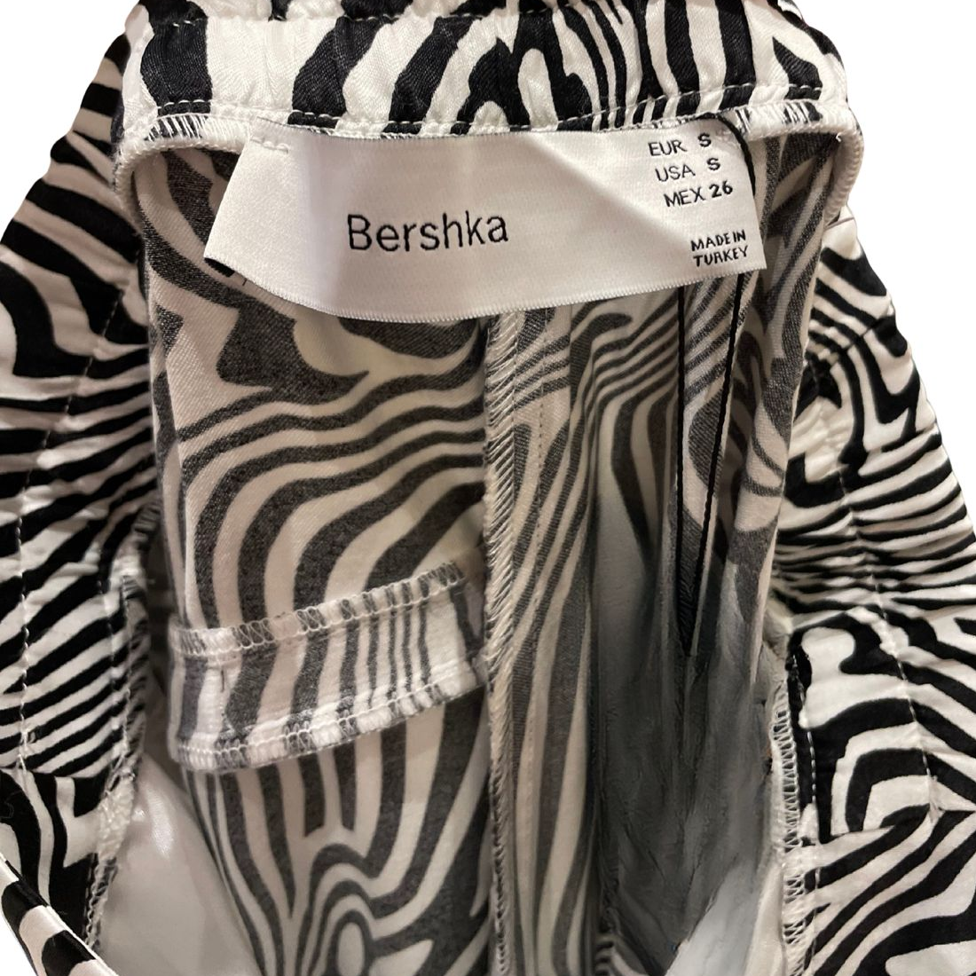 CALCA ALFAIATARIA ANIMAL PRINT BERSHKA